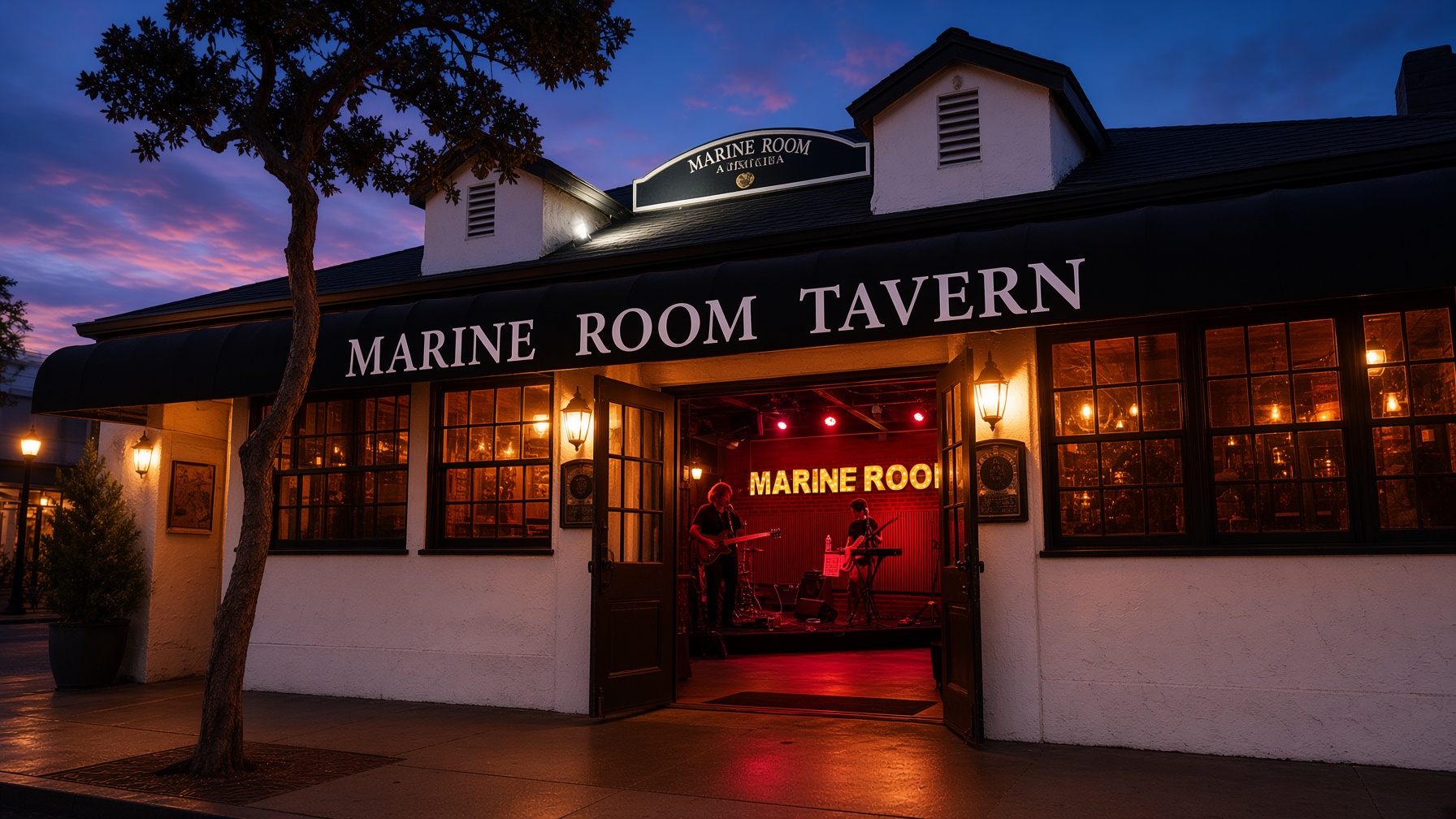 Marine Room Tavern at dusk with its doors open to a band playing on the red-lit stage